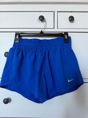 Nike Women's Royal Blue Athletic Shorts with Reflective Swoosh